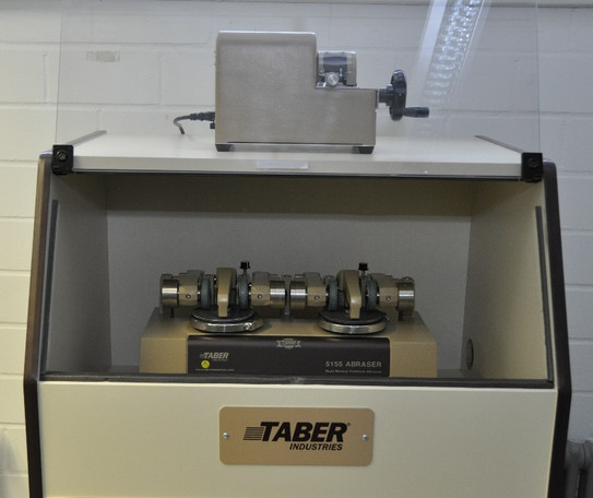 Abbildung des Taber Abrasion Testers